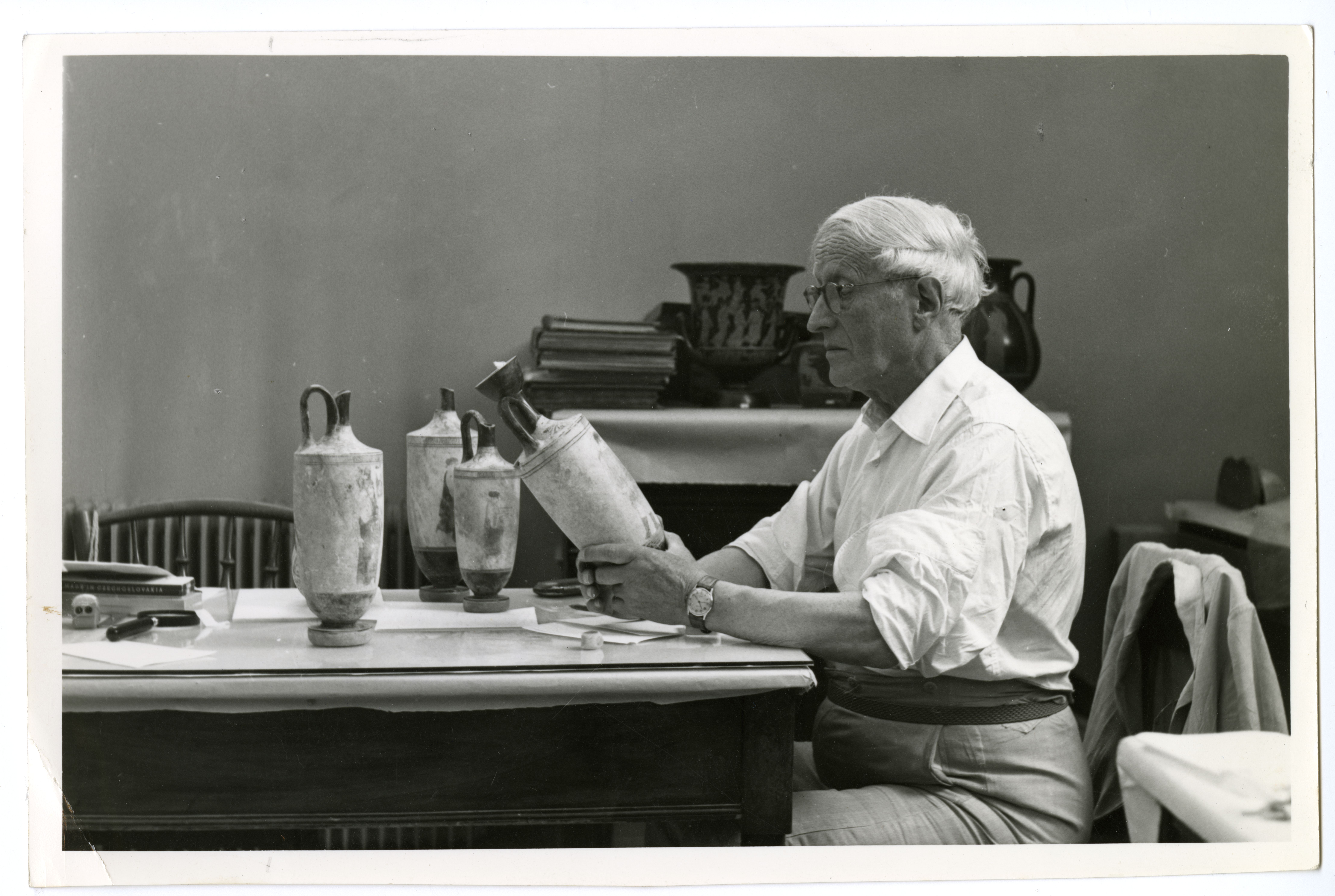 Figure 6 Sir John Beazley studying lekythoi